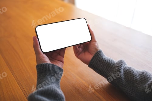 Preview: Mockup image of a woman holding mobile phone with blank desktop screen