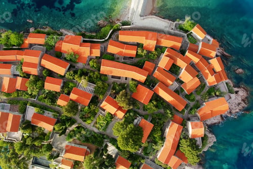 Preview: Amazing sunset aerial top drone view of Sveti Stefan island with historical town.