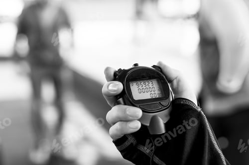 Preview: Closeup of hand holding stopwatch