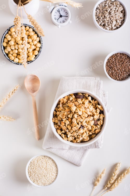 Preview: Dry granola, sesame seeds, flax seeds, sunflower seeds, chickpeas and quinoa. Top and vertical view