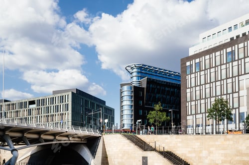 Preview: Modern office building in government district in Berlin Mitte against sky.