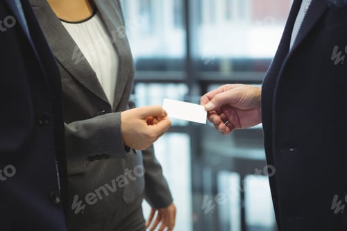 Preview: Business executives giving business cards to each other