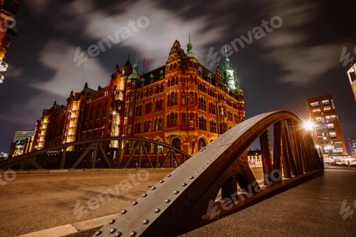 Preview: Old Speicherstadt in Hamburg illuminated at night. Arch bridge and historical buildings. Warehouse