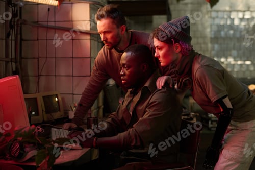 Preview: Friends Checking Data On Old Computer In Post-apocalyptic Shelter