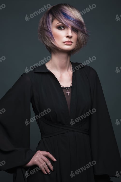 Preview: Beautiful girl in evening dress with avant-garde hairstyles. Beauty the face.