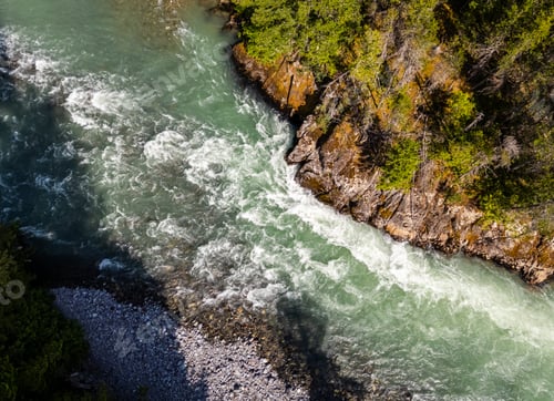 Preview: Aerial View of Rapids Flowing Along A Forested Riverbank in BC, Canada