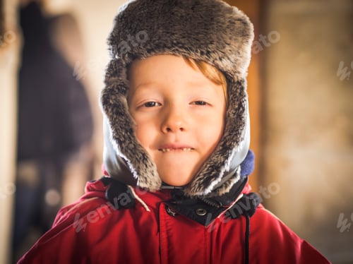 Preview: Little boy in snowsuit making funny expressions