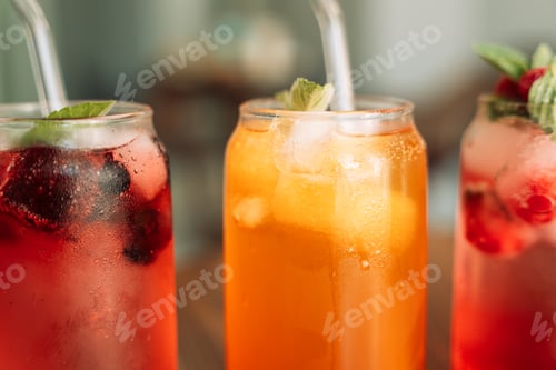 Preview: Fruit drinks with ice in glass glasses and straws