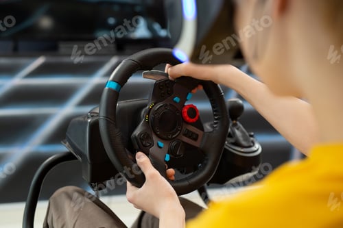 Preview: Close-up of the hands of a teenage boy in virtual reality glasses.