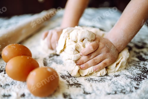 Preview: Children hands kneading dough for baking. Kids hands, some flour, wheat dough. Cookies for Christmas