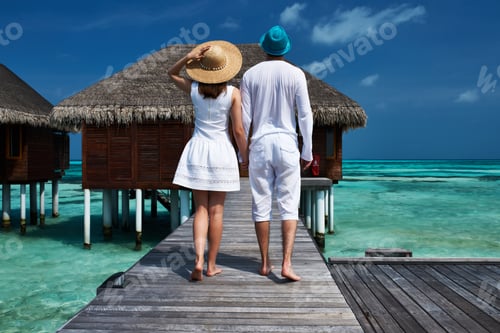 Preview: Couple On A Tropical Beach Jetty At Maldives