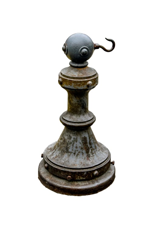 Preview: Metal restriction post with hook isolated on white background. Rust-covered restriction column.