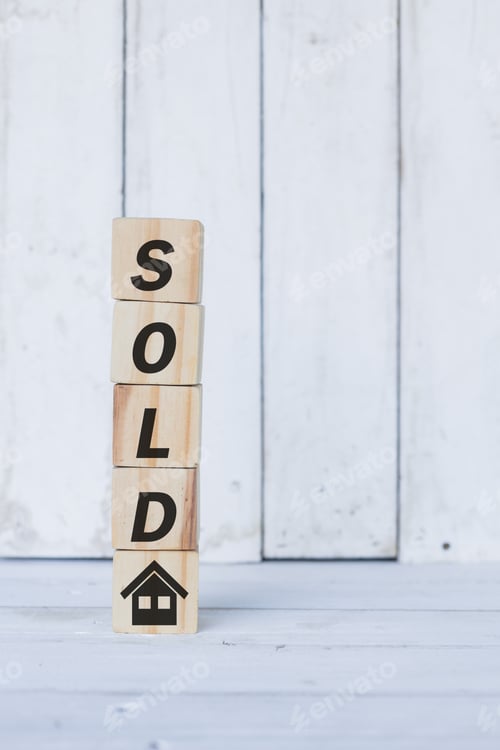 Preview: sold word or concept on wooden blocks, white wood background