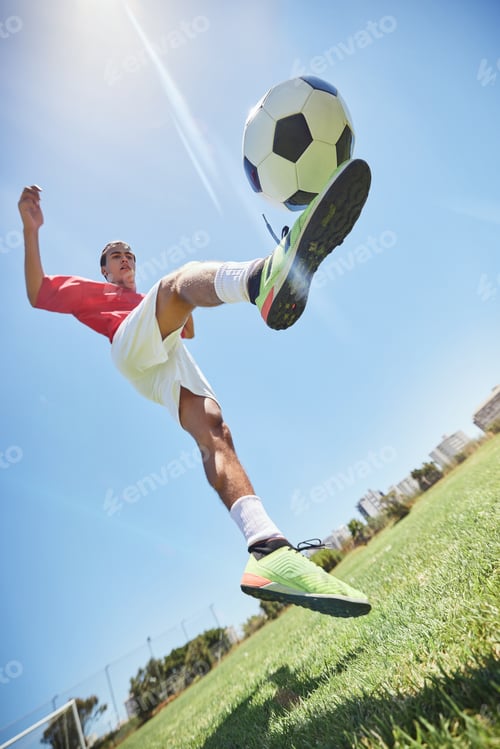 Preview: Football, fitness and soccer player training with a juggling exercise on soccer field, grass or foo