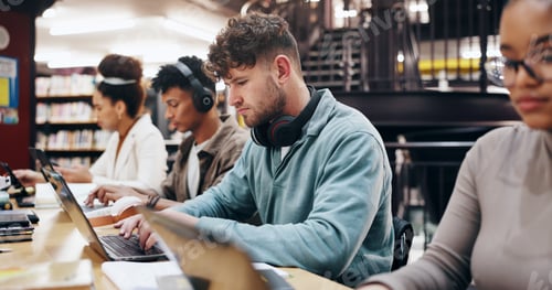 Preview: Man, studying and laptop in library for education, problem solving and working on research assignme