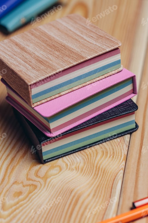 Preview: colorful notepads office wooden table paper work is education