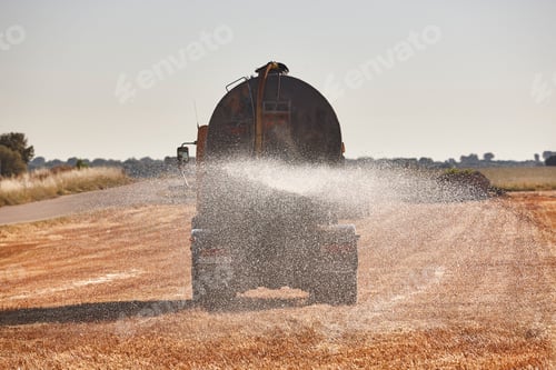 Preview: Truck irrigating a wheat field with fresh water. Efficiency agriculture