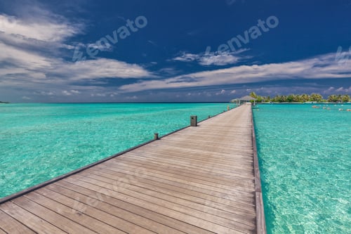 Preview: Wooden long jetty over lagoon in Maldives with amazing water