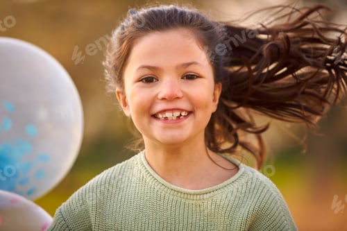 Preview: Portrait Of Girl Outdoors In Countryside Playing With Balloons