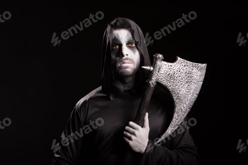 Preview: Evil grim reaper with an axe over black background