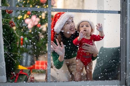 Preview: Asian couple doing activities together at home by the window, outside the house, snow is falling on