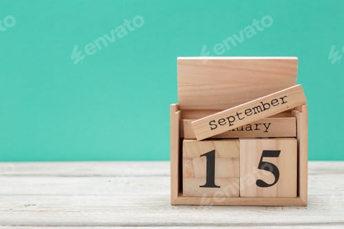 Preview: wooden cube shape calendar for september 15 on wooden tabletop