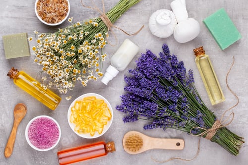 Preview: Essential oil and lavender, chamomile sea salt, spa, with flowers top view.