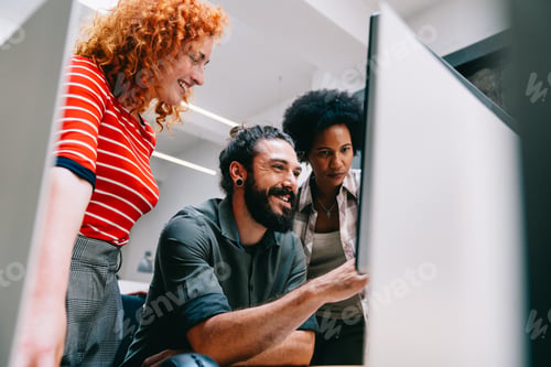 Preview: Smiling diverse colleagues gather in boardroom brainstorm discuss financial statistics together