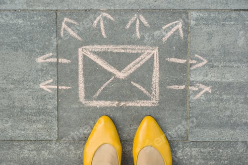 Preview: Female feet with abstract envelope message letter with arrows in different directions