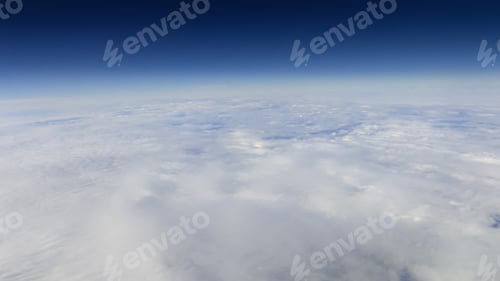 Preview: The beautiful cloudscape with clear blue sky. A view from airplane window.