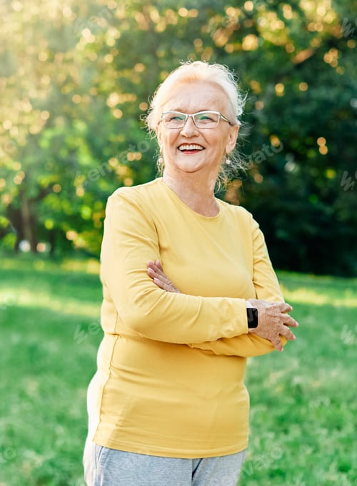 Preview: Senior Woman Smiling Outdoors in a Sunny Park