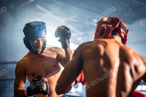 Preview: Two young professional boxer having a competition tournament on stage.