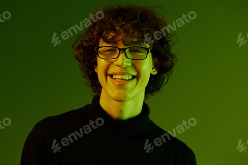 Preview: Man young man portrait close-up portrait in glasses fashion smile, hipster lifestyle, portrait green