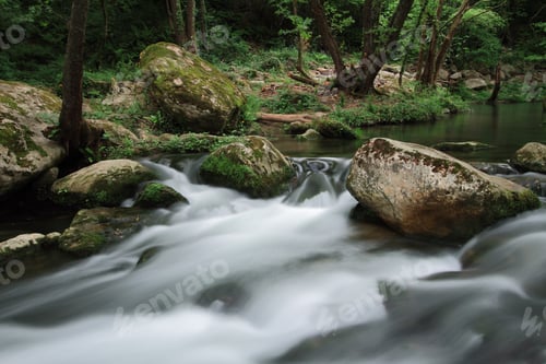 Preview: Silky river flow near waterfall known as Santa Margarida