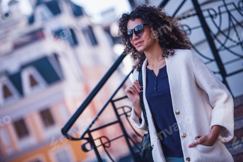 Preview: Young woman in city