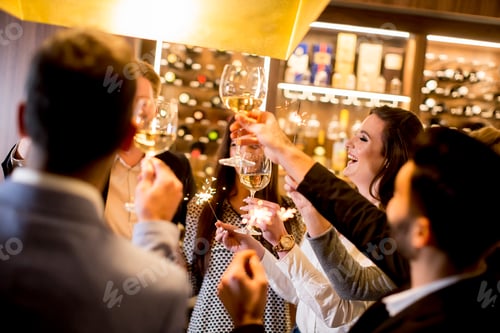 Preview: Young people toasting with white wine