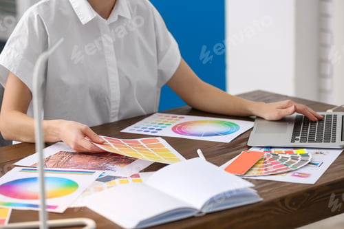 Preview: Professional interior designer at workplace in office, closeup