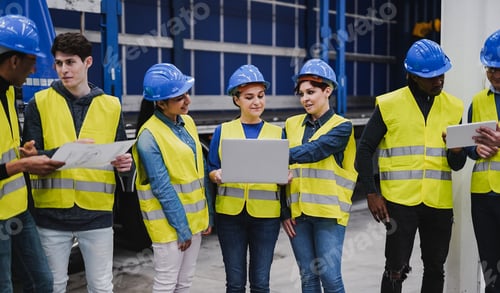 Preview: Multiracial people working inside warehouse while using computer laptop and tablet