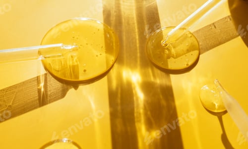 Preview: pipette drop of serum test on a yellow background sun glare