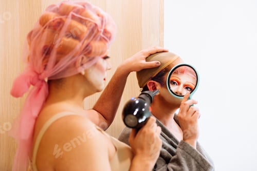 Preview: Men dressing up as drag queens while preparing for parade