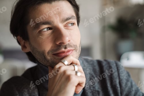 Preview: Close up of a handsome young bearded man