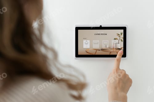 Preview: Woman pressing on smart home automation panel monitor