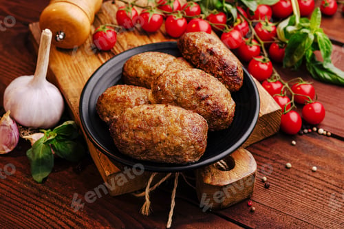 Preview: Juicy grilled meatballs served on a rustic wooden platter with fresh tomatoes and herbs
