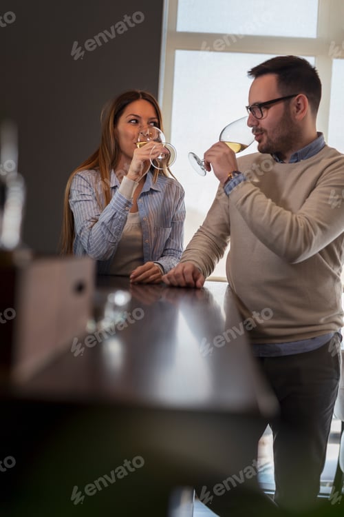 Preview: Couple tasting wine in a restaurant