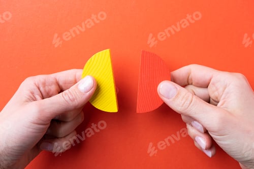 Preview: hands working with colorful wooden pie chart pieces