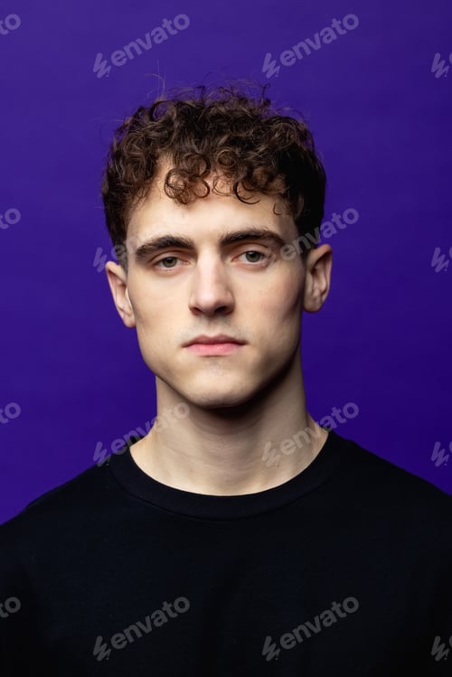 Preview: handsome men portrait studio. Coloured background. Young