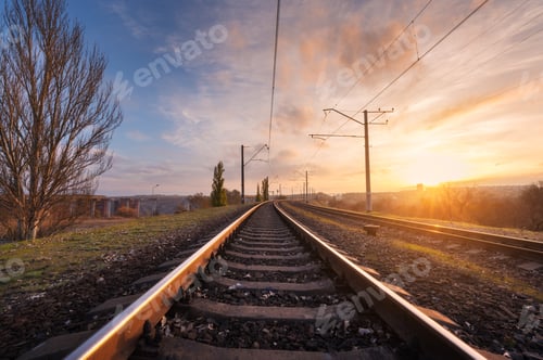 Preview: Railroad against beautiful sky at sunset. Industrial landscape