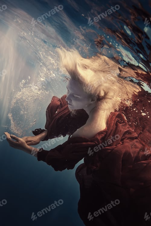 Preview: Portrait Of A Woman In A Red Dress Underwater