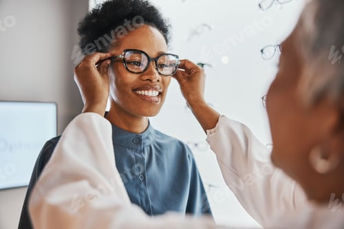 Preview: Glasses check, black woman and customer with store worker and optician looking at lense. Eye consul