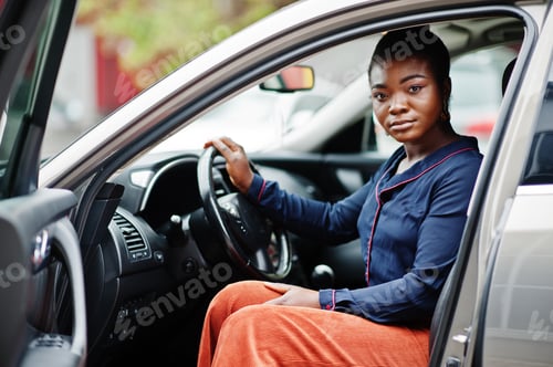 Preview: African businesswoman and car